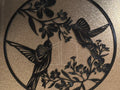 2 Hummingbirds in a circle Drinking